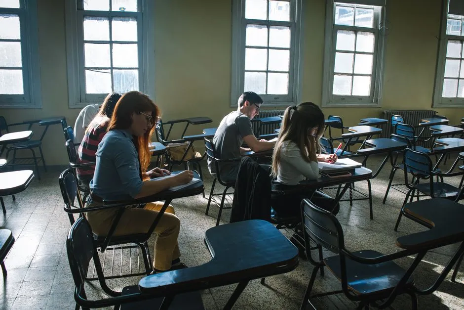 Students taking a timed test in a classroom